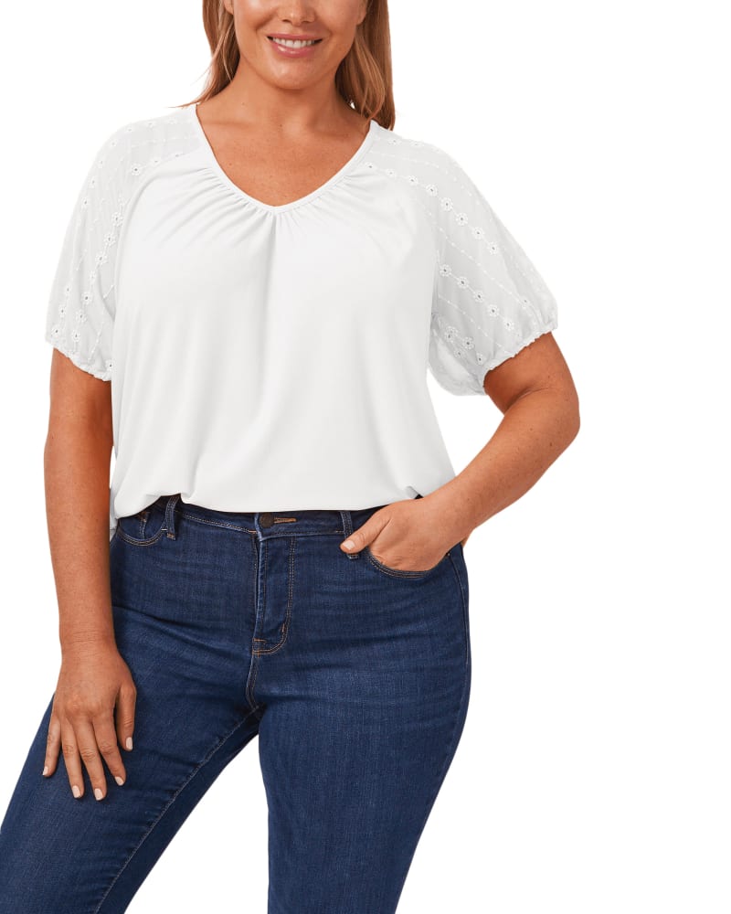 Front of a model wearing a size 1X Mila Embroidered Puff Sleeve Top in 105-SOFT ECRU by CeCe. | dia_product_style_image_id:263434